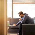 man thinking office window